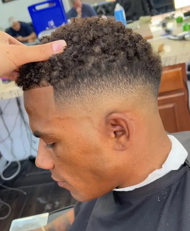 Curly top with high fade by Mike Prosch, Palm Springs barber