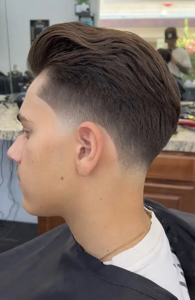 Voluminous slick back with low taper by Mike Prosch, Palm Springs barber